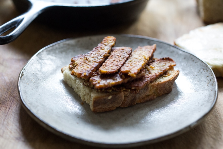 Tempeh Reuben Sandwich with Smoked Mozzarella and Turmeric Sauerkraut ( or sub regular!). A tasty, hearty, delicious vegetarian sandwich! | www.feastingathome.com