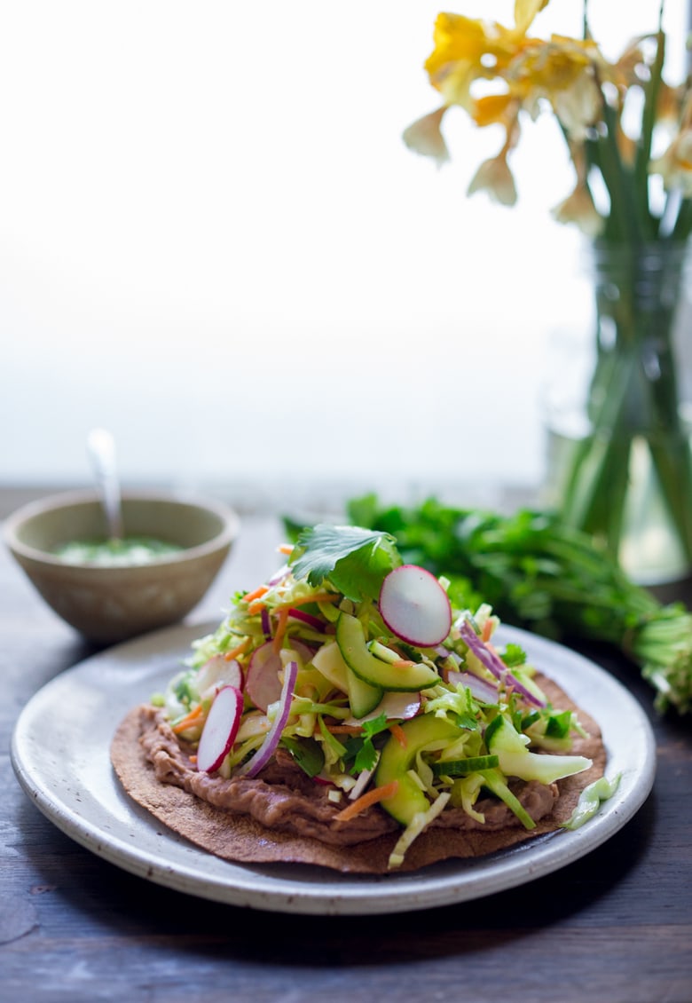 How to make Tlayudas de Oaxaca- Oaxacan Street "pizza" that is not only delicious, its healthy and light! Vegan and GF adaptable! | www.feastingathome.com