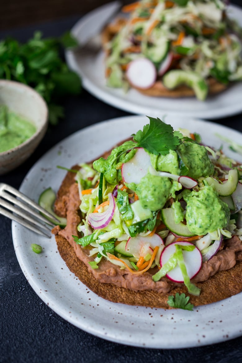 A simple tasty recipe for Tlayudas de Oaxaca - Mexican Street food that is not only delicious, it's light and healthy! Perfect for your next Mexican Feast! Vegan and GF adaptable! | www.feastingathome.com