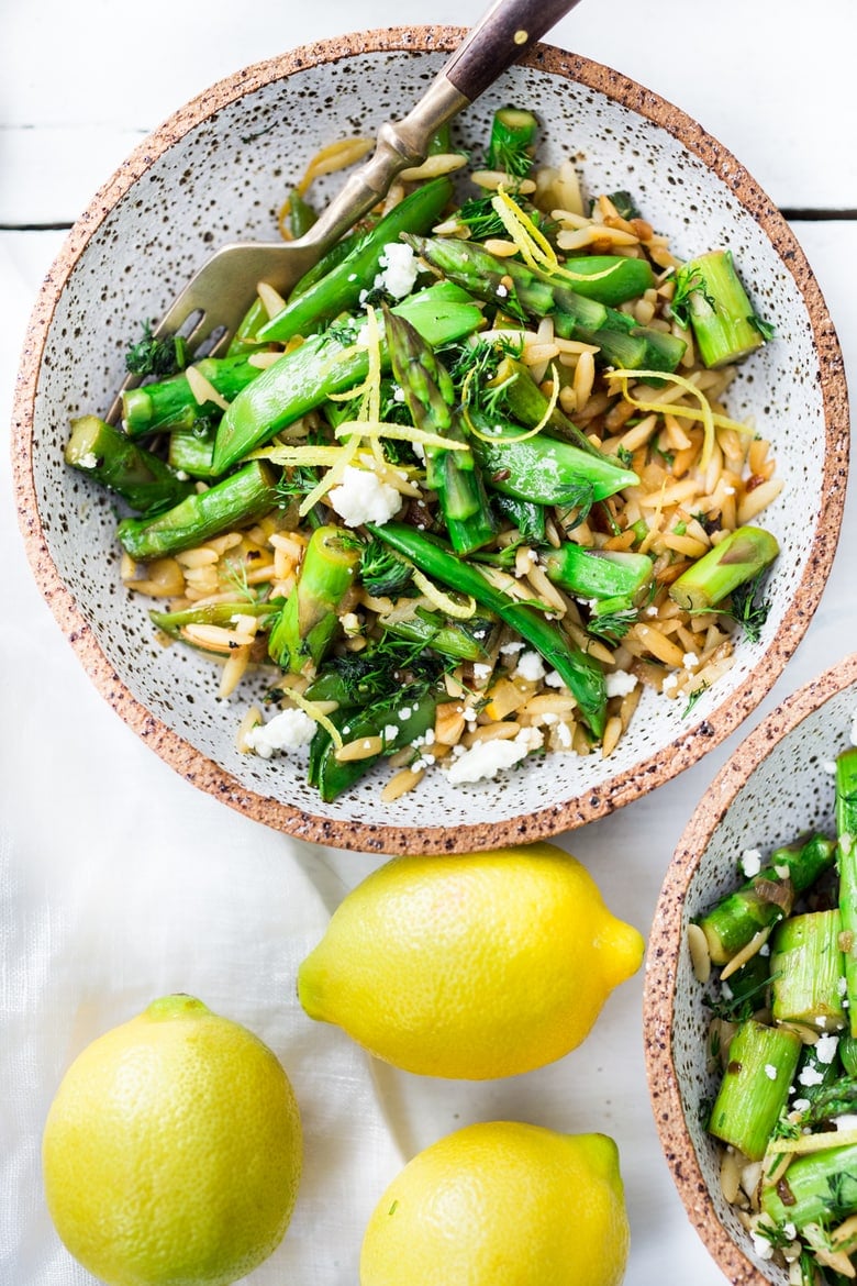 This recipe for Lemon Orzo with Asparagus- is perfect for spring! Quick and easy, serve this spring pasta "warm" as a dinner,  or chilled as a side salad. Vegan adapatable. 