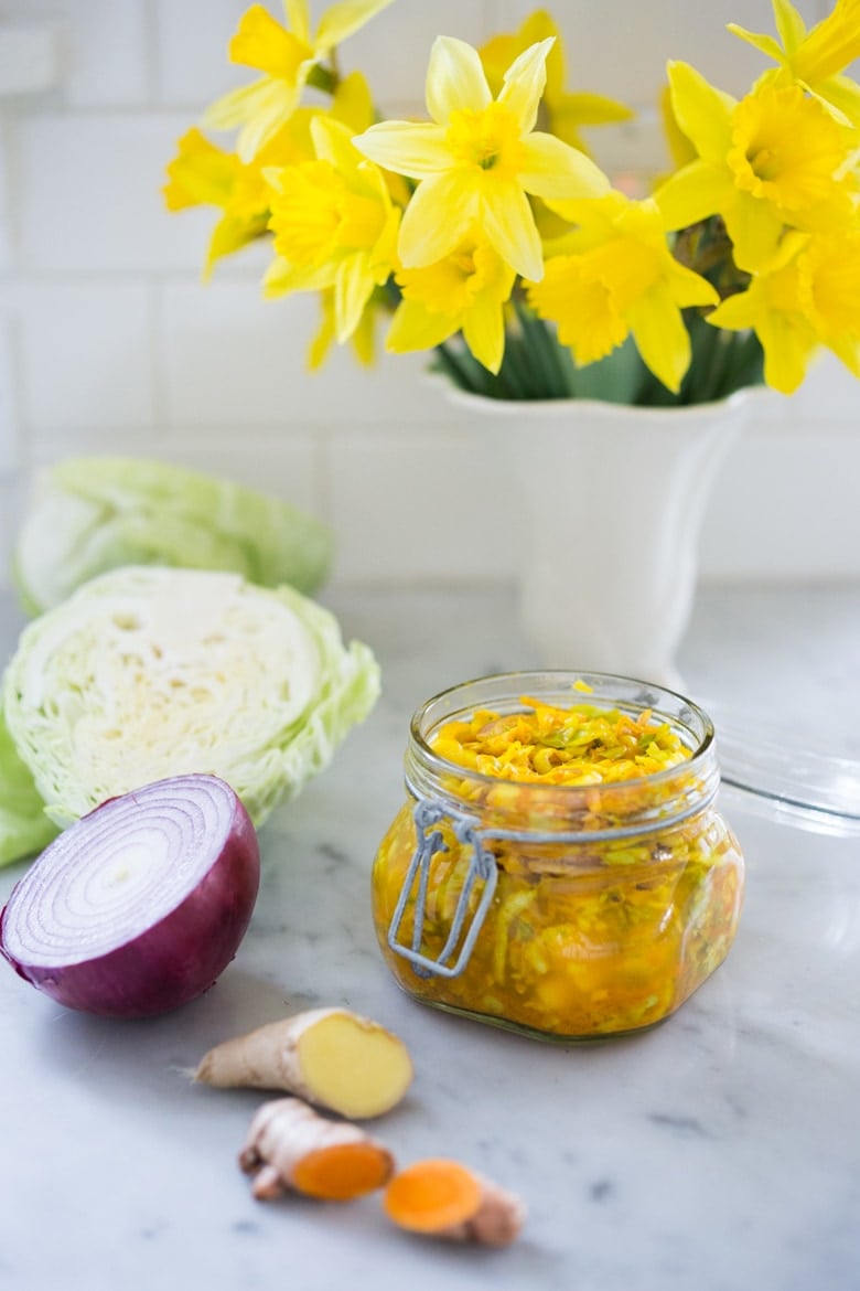 Turmeric Sauerkraut- a small-batch recipe that can be put together in 10 minutes, and sits on the couture for 3-5 days. | www.feastingathome.com