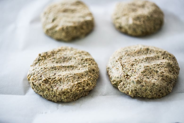 Sprouted Lentil Burgers- grillable, vegan and gluten-free adaptable. Super healthy and delicious, packed with living nutrients! Topped with quick picked beets. | www.feastingathome.com