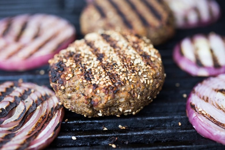 Sprouted Lentil Burgers- grillable, vegan and gluten-free adaptable. Super healthy and delicious, packed with living nutrients! Topped with quick picked beets. | www.feastingathome.com
