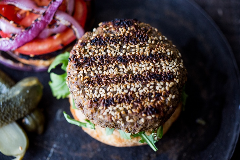 Sprouted Lentil Burgers- grillable, vegan and gluten-free adaptable. Super healthy and delicious, packed with living nutrients! Topped with quick picked beets. | www.feastingathome.com