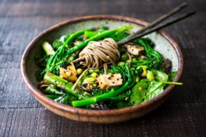 Vegan soba noodles loaded up with fresh seasonal veggies ad sesame dressing.