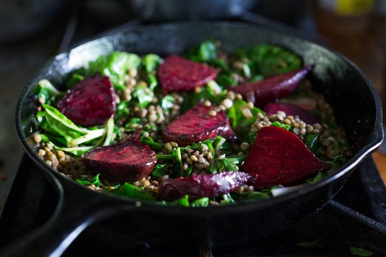 Warm Lentils with wilted chard, roasted beets, goat cheese and spring herbs. A simple tasty vegetarian meal! | www.feastingathome.com