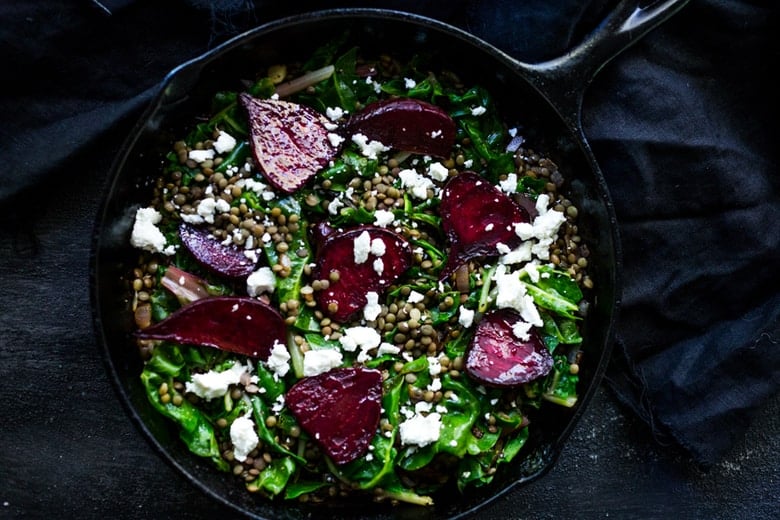 Warm Lentils with wilted chard, roasted beets, goat cheese and spring herbs. A simple tasty vegetarian meal! | www.feastingathome.com