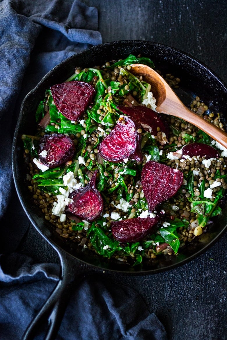 Warm Lentils with wilted chard, roasted beets, goat cheese and spring herbs. A simple tasty vegetarian meal! | www.feastingathome.com