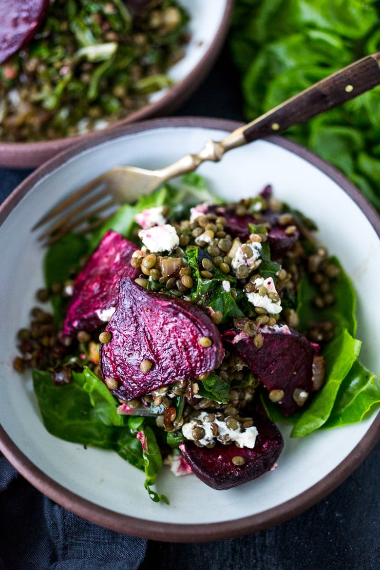 Warm Lentils with wilted chard, roasted beets, goat cheese and spring herbs. A simple tasty vegetarian meal! | www.feastingathome.com