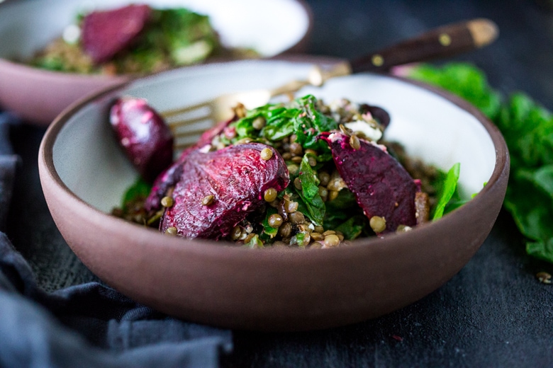 Warm Lentils with wilted chard, roasted beets, goat cheese and spring herbs. A simple tasty vegetarian meal! | www.feastingathome.com