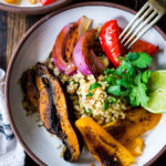 Vegan Fajitas with Cauliflower Rice are loaded up with healthy veggies that are lathered in flavorful Mexican Marinade and served over cauliflower "rice". The best thing? You can bake it all on a sheet pan with just 15 minutes of hands-on time. Keep it vegan or add chicken!