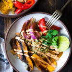 Sheet Pan Veggie Fajita Bowl with Cilantro Cauliflower Rice- a filling, low calorie meal that is vegan & gluten-free and only takes 15 minutes of hands-on time! Keep it vegan or add chicken. | www.feastingathome.com