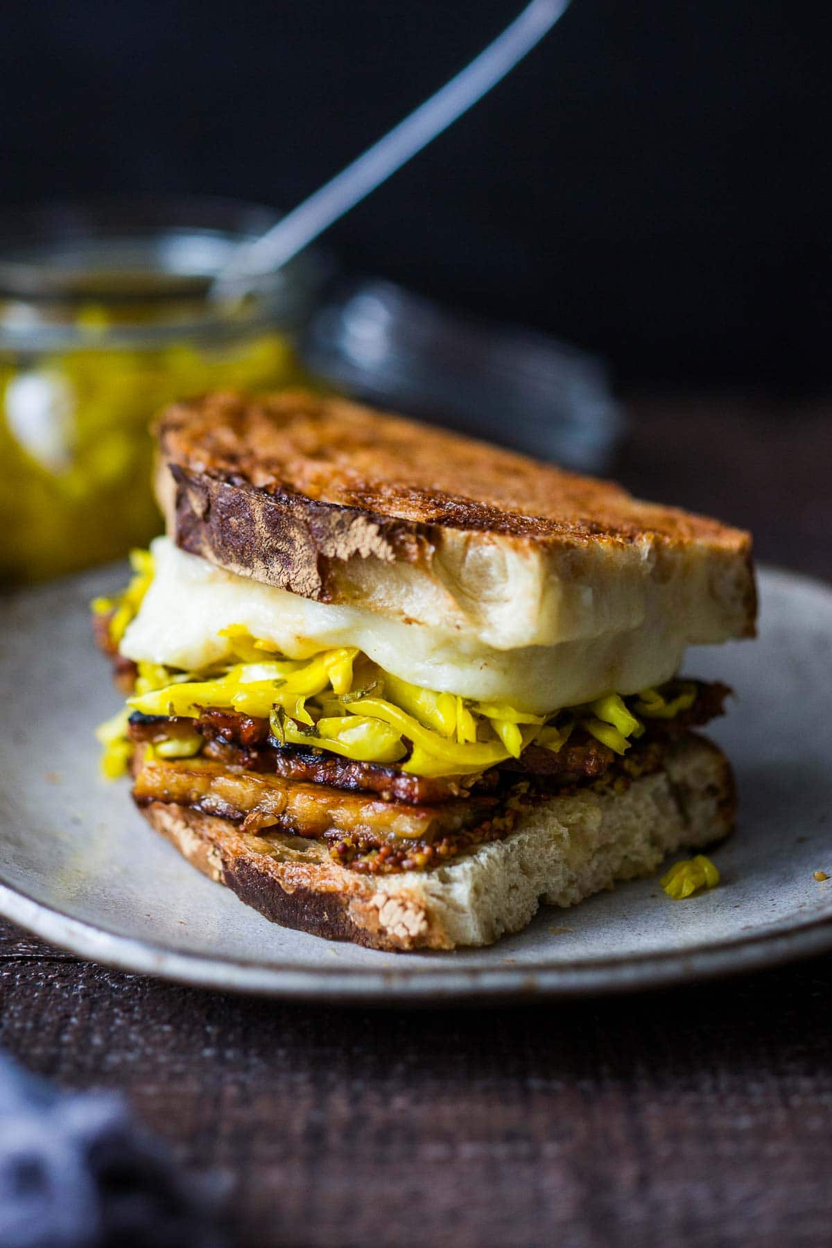 This toasty Tempeh Reuben Sandwich is so delicious! Made with melty cheese, flavorful seared tempeh, and Sauerkraut, keep it vegetarian or use vegan cheese for a vegan reuben! 