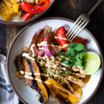 Vegan Fajita Bowls with Roasted Portobello Mushrooms and peppers served over Cilantro Lime Cauliflower Rice- a fast sheet-pan dinner that is perfect for weeknights! #fajitabowl #veganfajita #fajitas #sheetpandinner #veganbowls #buddhabowls #plantbased #cleaneating #eatclean #vegan