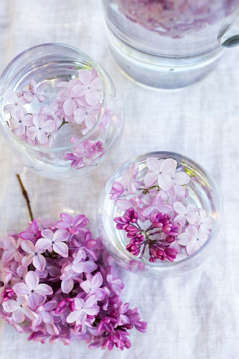 Lilac Water- water infused with lilac blossoms calms and restores the spirit. Perfect for weddings or celebrations, a lovely way to celebrate spring. | www.feastingathome.com #lilacwater