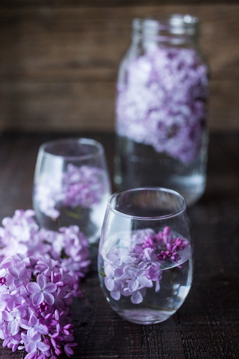 Lilac Water- water infused with lilac blossoms calms and restores the spirit. Perfect for weddings or celebrations, a lovely way to celebrate spring. | www.feastingathome.com #lilacwater