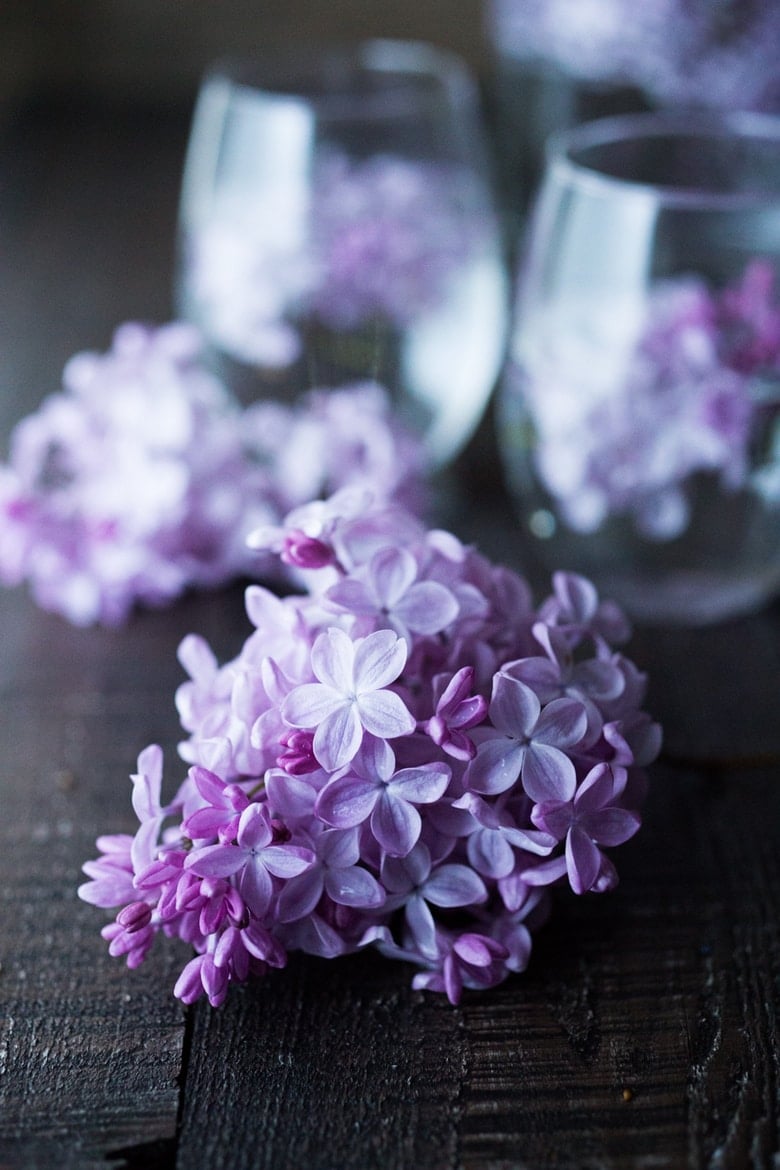 Lilac Water- water infused with lilac blossoms calms and restores the spirit. Perfect for weddings or celebrations, a lovely way to celebrate spring. | www.feastingathome.com #lilacwater