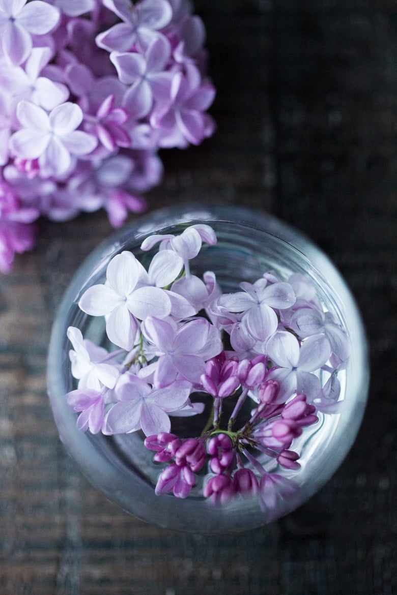 Lilac Water- water infused with lilac blossoms calms and restores the spirit. Perfect for weddings or celebrations, a lovely way to celebrate spring. | www.feastingathome.com #lilacwater