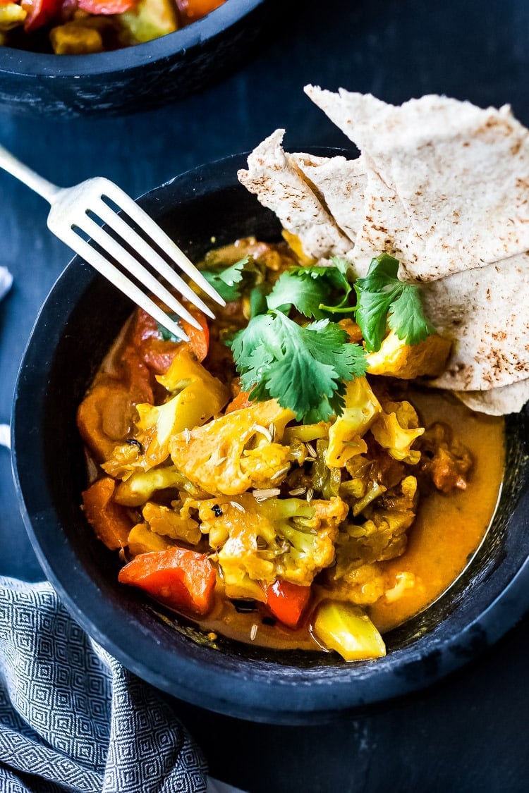 Vegan Tikka Masala with Cauliflower that can be made in an Instant Pot or on the stove top in under 25 minutes! An easy, healthy, keto friendly weeknight meal! | www.feastingathome.com #tikkamasala #cauliflower #veganmasala #vegetarian #easy #instantpotmasala #keto #veganketo #vegantikkamasala #cauliflowerrecipes