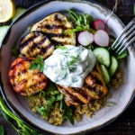 Grilled Salmon Tzatziki Bowl- a fast and delicious weeknight meal loaded up with healthy veggies! | www.feastingathome.com