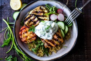 Grilled Salmon Tzatziki Bowl- a fast and delicious weeknight meal loaded up with healthy veggies! | www.feastingathome.com