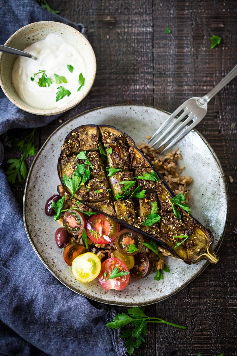 Zataar Roasted Eggplant served over rice or grains with lemony tahini sauce, plain yogurt or tzatzki sauce. Vegan, Gluten-free! | www.feastingathome.com 