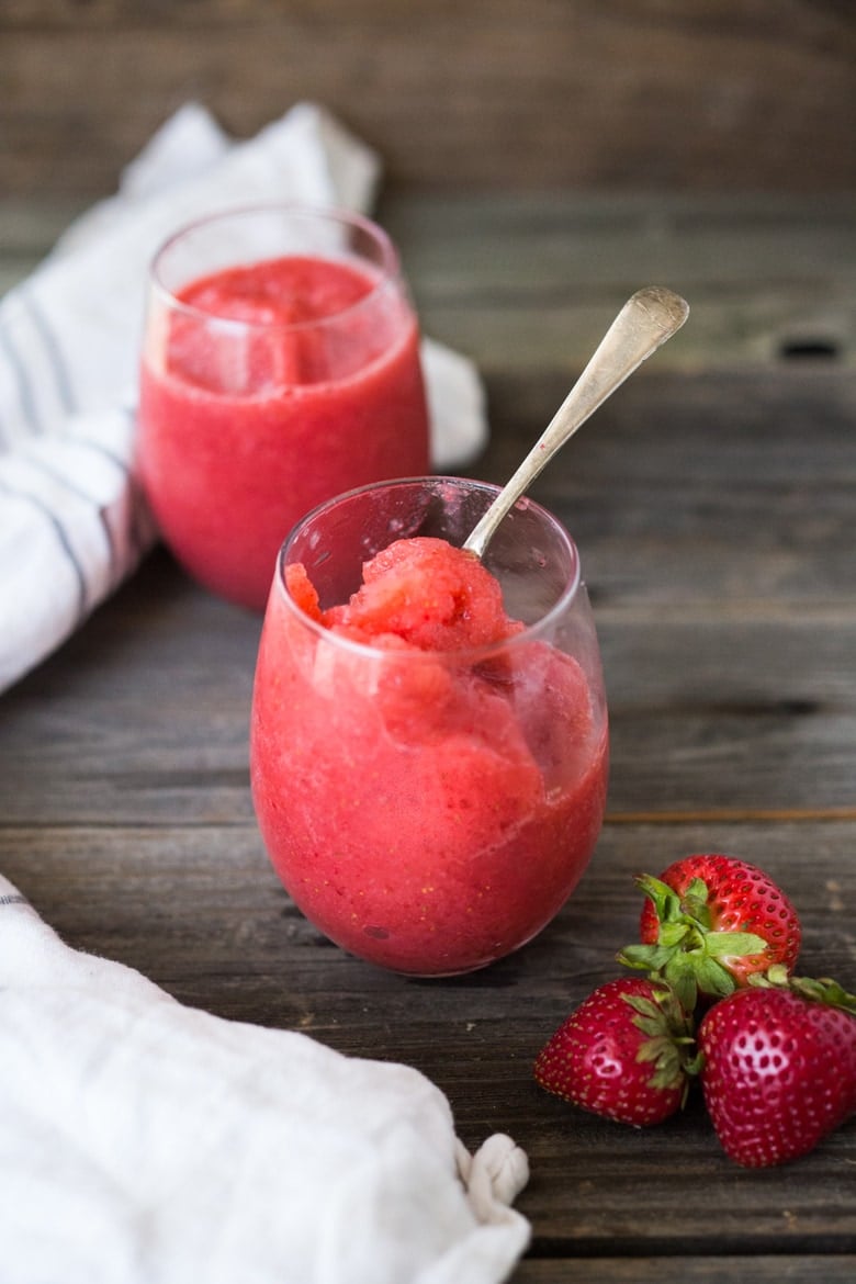 How to make a slushie! A healthy, delicious, 3-ingredient alternative to ice cream- made with fresh berries, natural sweetener,  a squeeze of citrus and ice!  Low in fat and calories, high in antioxidants. Make this in 5 minutes using your blender! So easy and refreshing. 