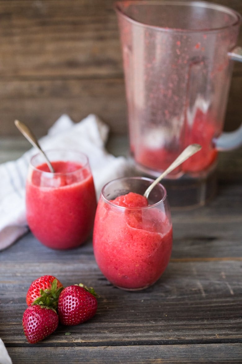 How to make a slushie! A healthy, delicious, 3-ingredient alternative to ice cream- made with fresh berries, natural sweetener,  a squeeze of citrus and ice!  Low in fat and calories, high in antioxidants. Make this in 5 minutes using your blender! So easy and refreshing. 