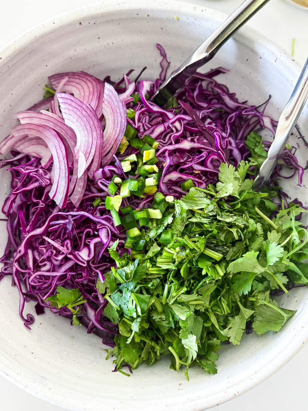 fish taco slaw ingredients in a bowl. 