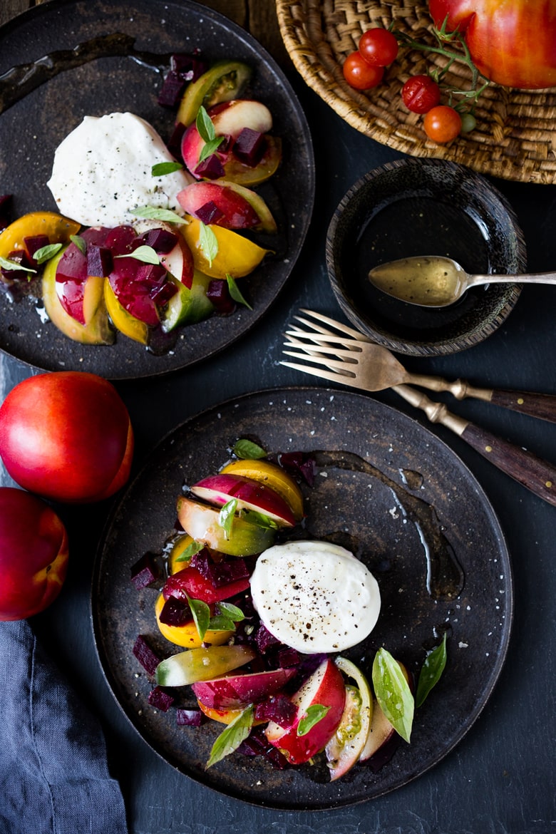 Burrata Salad with nectarines, summer tomatoes, fresh basil, creamy burrata cheese and a balsamic vinaigrette dressing. 