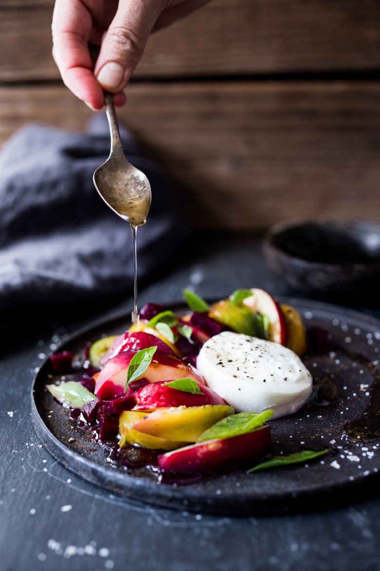 Burrata Salad with nectarines, summer tomatoes, fresh basil, creamy burrata cheese and a balsamic vinaigrette dressing. 