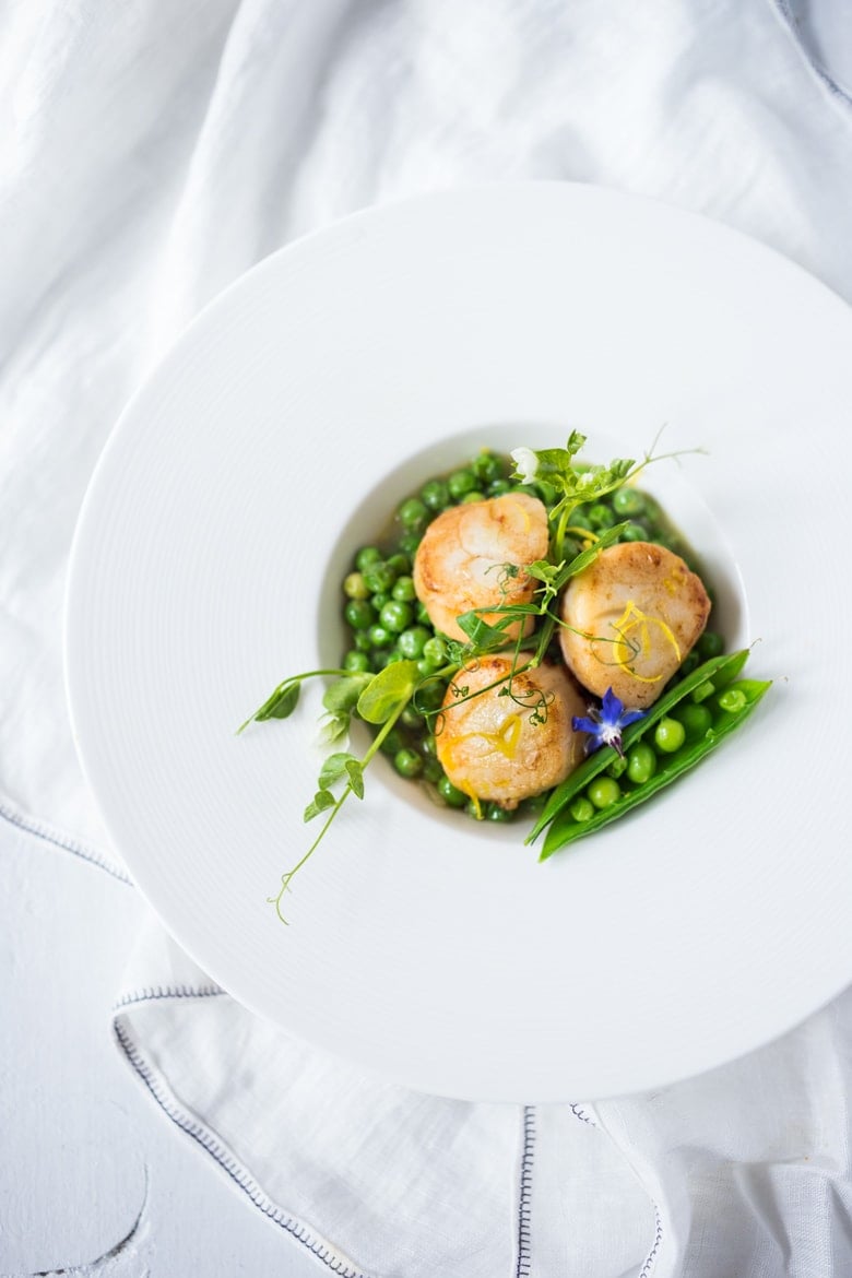 Seared Scallops with Spring peas, tarragon and truffle oil- a light and elegant meal, perfect for entertaining or special occasions. | www.feastingathome.com