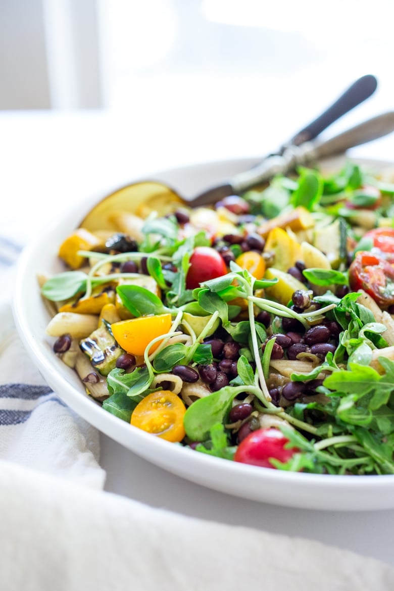 20 Healthy Pasta Recipes: Summer Pasta with Grilled zucchini and summer squash, corn, black beans and cherry tomatoes! Serve this warm for dinner and save the rest for weekday lunches! www.feastingathome.com