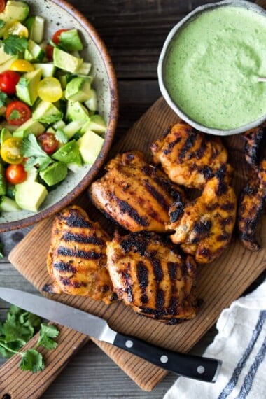 Simple, delicious Grilled Peruvian Chicken with Green Sauce and an Avocado Tomato Cucumber Salad. Can be made in 40 minutes- perfect for weeknights!