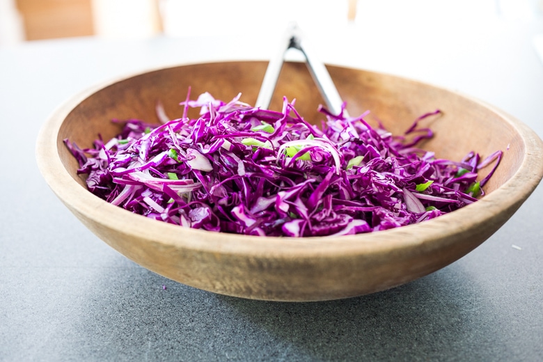 A simple,delicious and healthy recipe for Sesame Cabbage Noodle Salad with rice noodles, scallions cilantro and crunchy roasted peanuts. Vegan, Gluten-free! | www.feastingathome.com