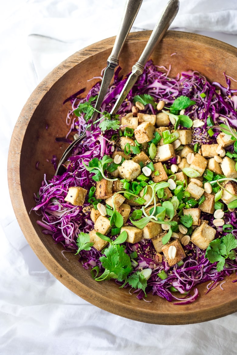 Sesame Cabbage Noodle Salad with rice noodles, crispy tofu, scallions cilantro and crunchy roasted peanuts. Vegan, Gluten-free! | www.feastingathome.com #crispytofu #noodles #noodlesalad #cabbagesalad #asiancabbagesalad #vegan