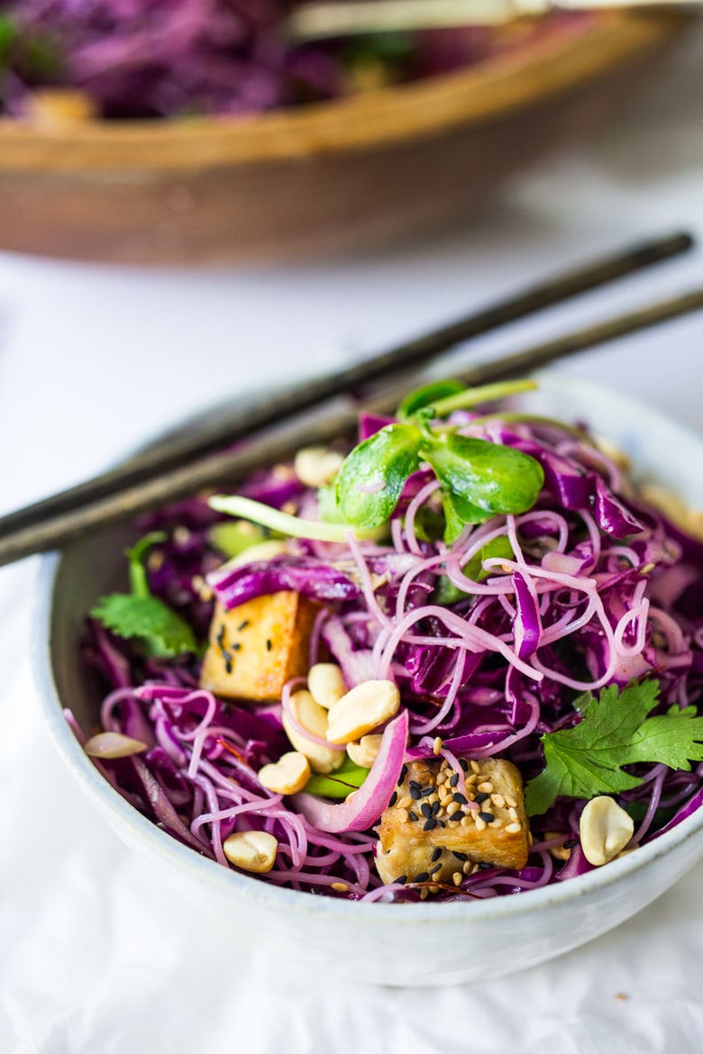 A simple,delicious and healthy recipe for Sesame Cabbage Noodle Salad with rice noodles, scallions cilantro and crunchy roasted peanuts. Vegan, Gluten-free! | www.feastingathome.com