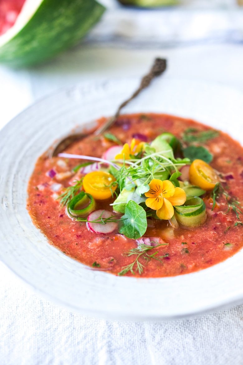 Cool and refreshing, Watermelon Gazpacho is just what the doctor ordered on hot summer days! Topped with cool crunchy cucumber, red onion, red bell pepper, avocado, microgreens, and fresh herbs, it’s a treat for the senses and nourishing to the body!