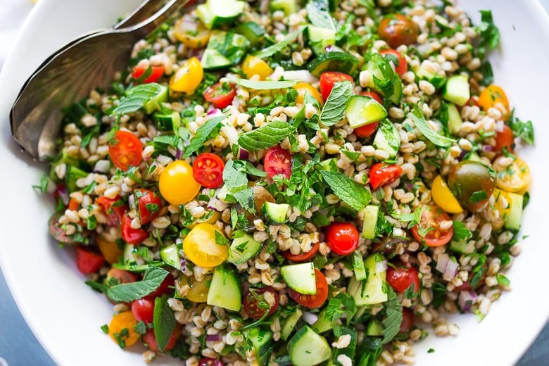 Farro Tabbouleh Salad with tomatoes, cucumber, fresh herbs and a simple lemon dressing. | www.feastingathome.com