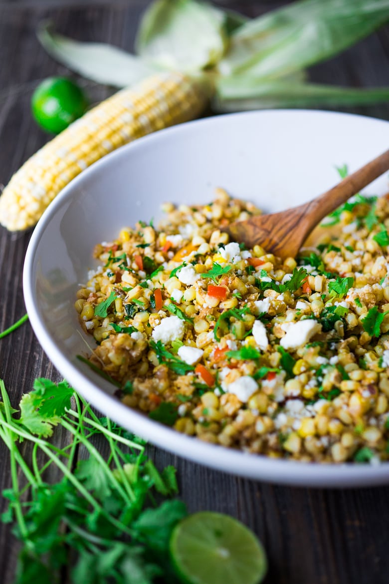 Elote Recipe - Mexican Street Corn with chilies, cilantro and lime. This lighter version can be grilled or sautéed and can easily be made vegan! | #elote #elotes #streetcorn #mexicanstreetcorn www.feastingathome.com 