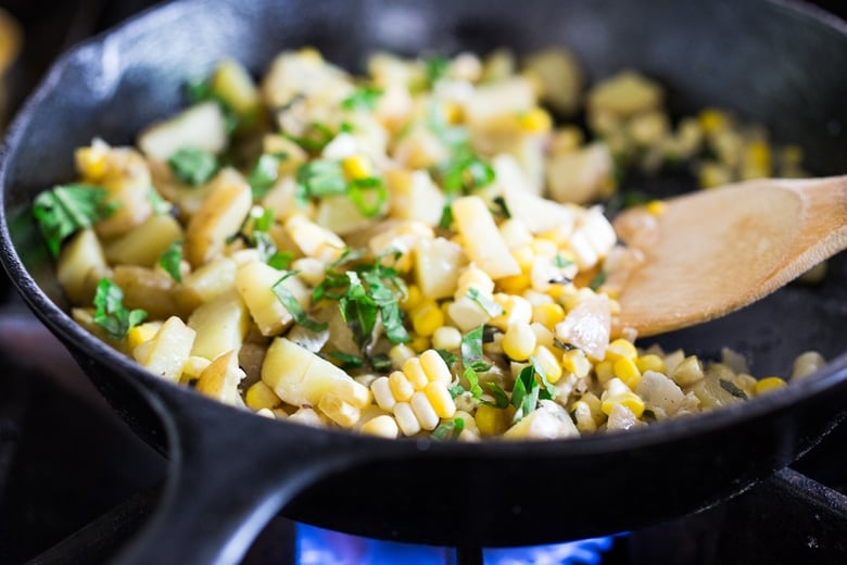 Summer Corn and Basil "Chowder" topped with Seared White Fish- a light and fresh summery dinner that can be made in under 30 minutes. | www.feastingathome.com