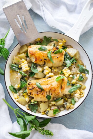 Fresh Corn Chowder with basil and white fish -a light and healthy summery dinner that can be made in under 30 minutes. Use halibut, cod, sea bass, salmon or scallops!