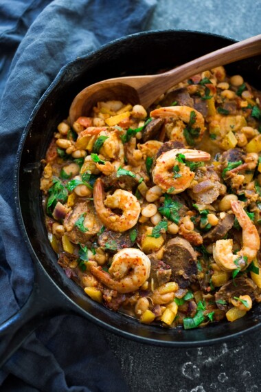 Spanish White bean, Shrimp and Sausage Skillet- a simple, healthy & flavorful, one-pan meal that can be on the table in 20 minutes! | www.feastingathome.com