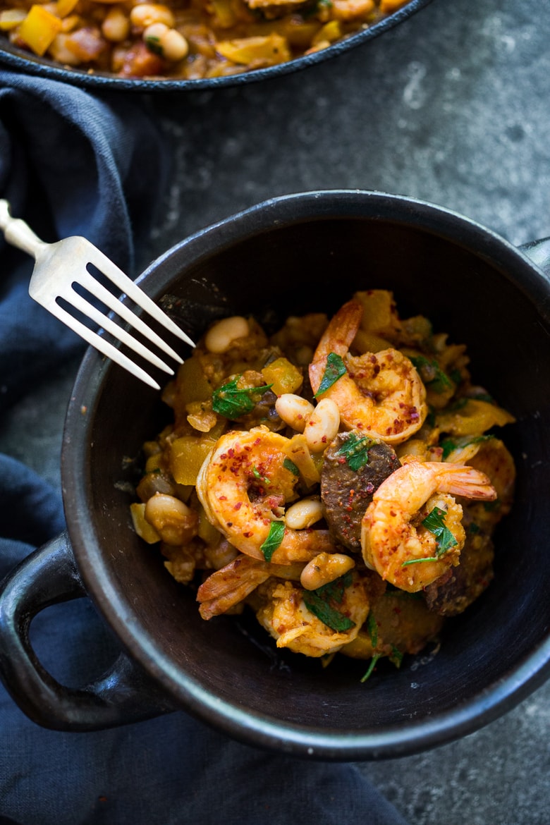 Spanish White bean, Shrimp and Sausage Skillet- a simple, healthy & flavorful, one-pan meal that can be on the table in 20 minutes! | www.feastingathome.com