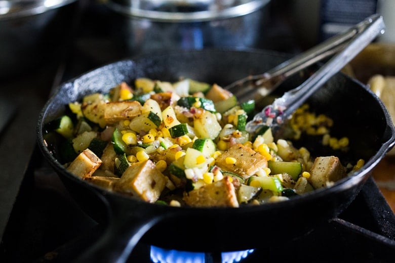 A fast and healthy dinner -Zucchini, Corn and Basil Skillet topped with your choice of shrimp, tofu or chicken. Simple and adaptable. Vegan, Gluten-free! 