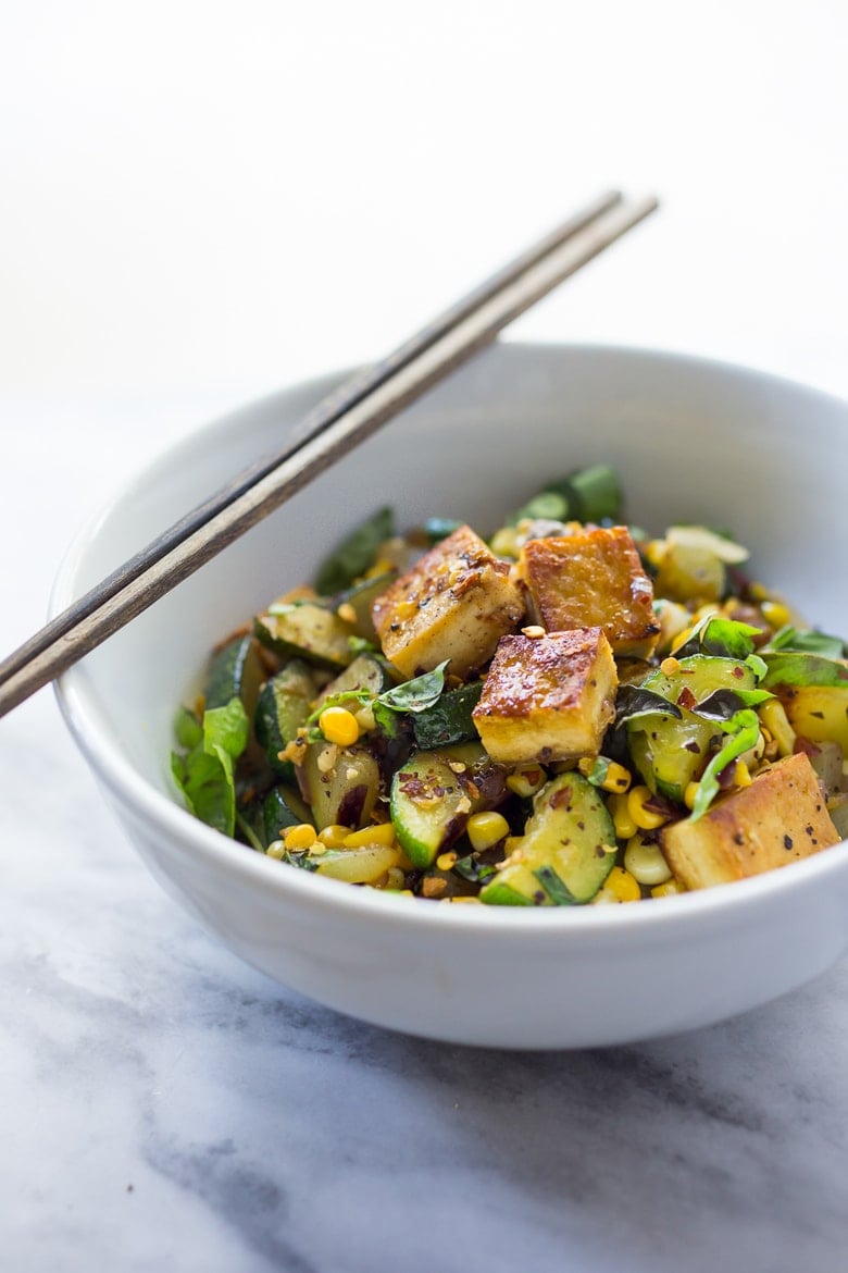 A fast and healthy dinner -Zucchini, Corn and Basil Stir-fry topped with your choice of shrimp, tofu or chicken. Simple and adaptable. Vegan, Gluten-free! 