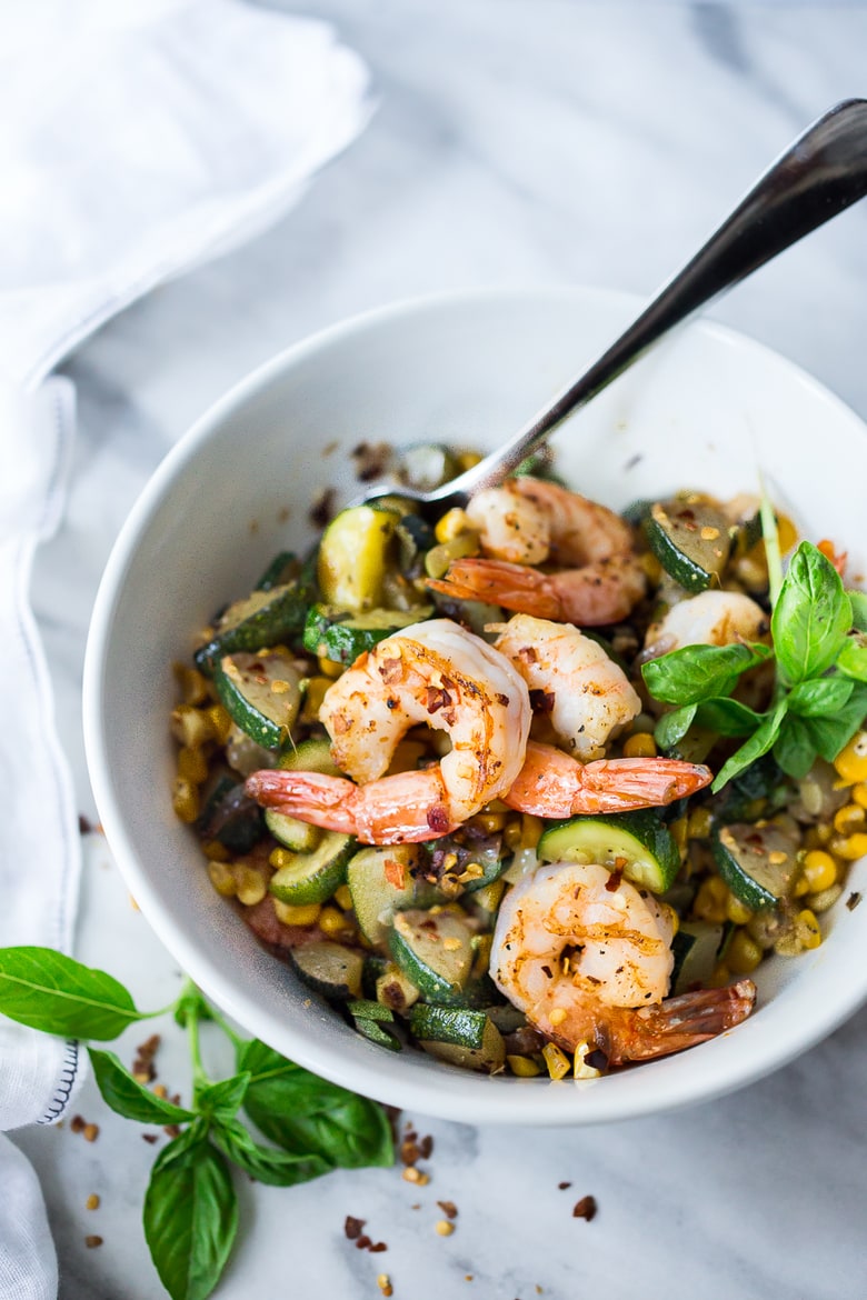 A fast and healthy dinner -Zucchini, Corn and Basil Stir-fry topped with your choice of shrimp, tofu or chicken. Simple and adaptable. Vegan, Gluten-free! 