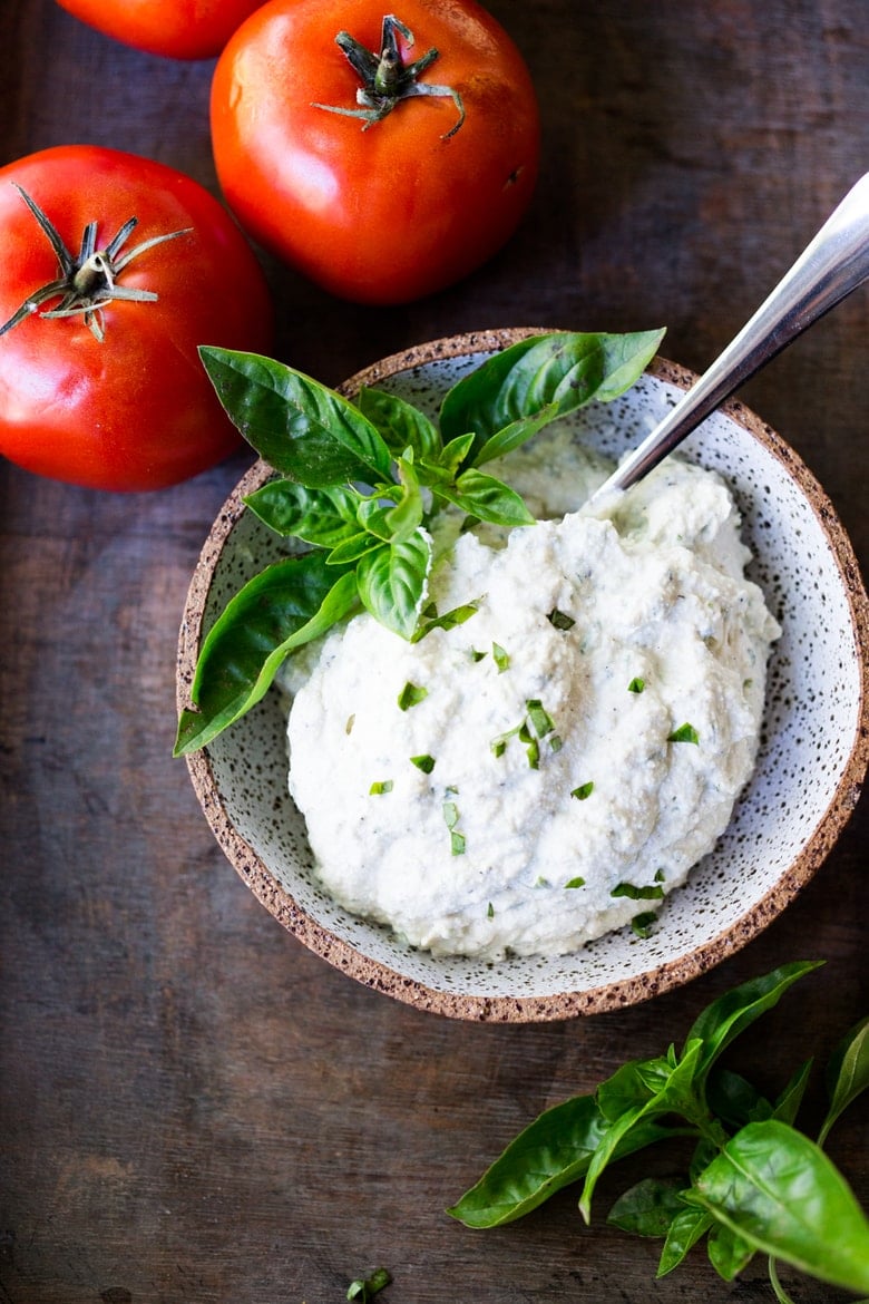 How to make the BEST vegan Tofu Ricotta - a healthy, nut-free, low calorie, zero cholesterol alternative to ricotta cheese, perfect for lasagna, cannelloni, and other baked dishes where you want a creamy, "cheesy" texture.  #vegancheese #tofuricotta #veganricotta #tofuricottarecipe www.feastingathome.com