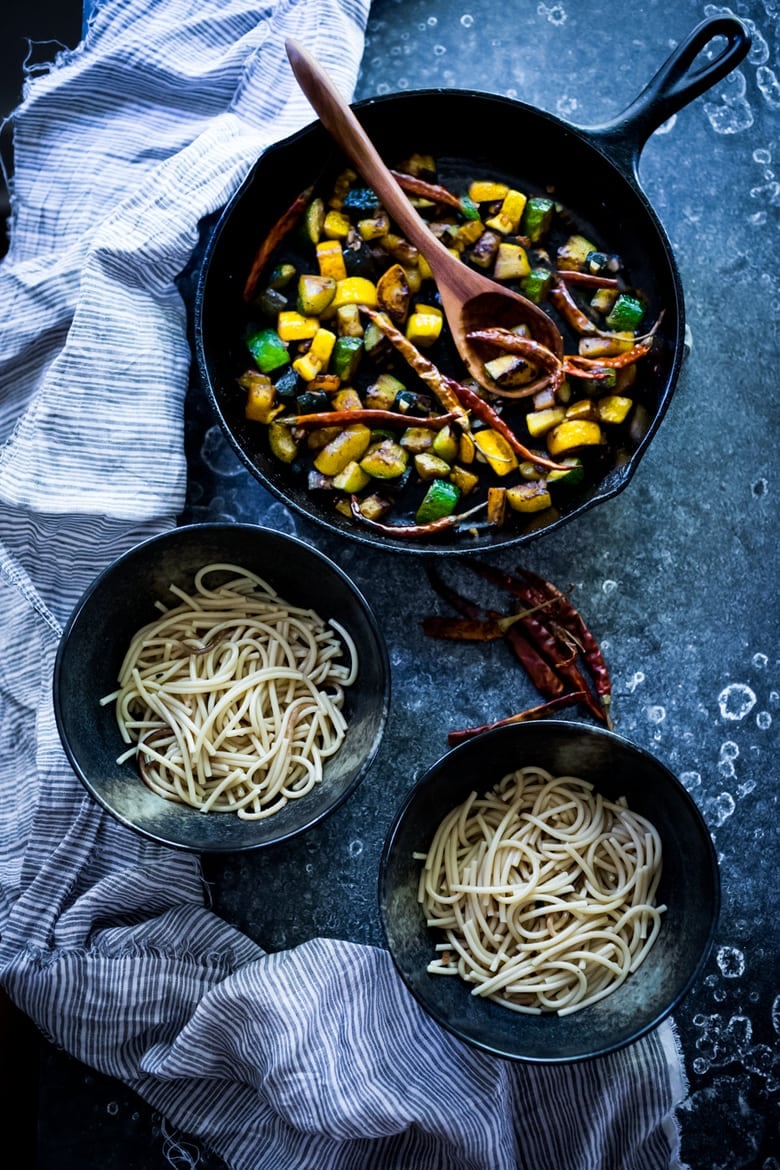 A simple delicious recipe for Kung Pao Zucchini over noodles or rice. Vegan and gluten-free adaptable! | www.feastingathome.com 