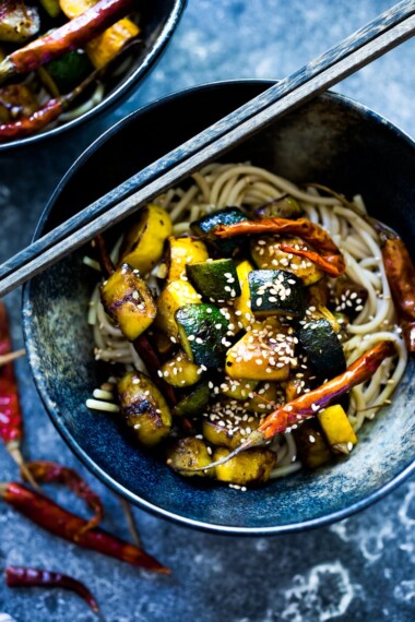 A simple delicious recipe for Kung Pao Zucchini over noodles or rice. Vegan and gluten-free adaptable! | www.feastingathome.com